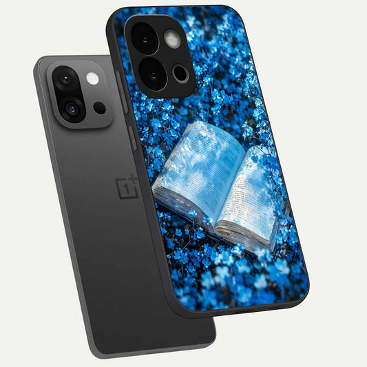 Blue Bloom Tales phone case For OnePlus 13S showing premium glass back cover with detailed artwork