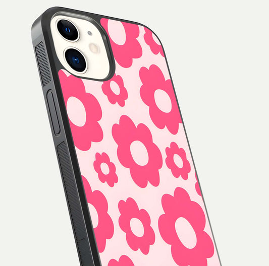 Blush Flower Pop iPhone 12 glass phone case angled back view highlighting bright floral pop design and side grip texture