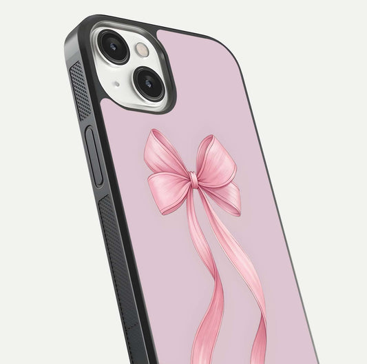 Soft Blush Bow iPhone 13 glass phone case angled back view highlighting bow artwork and side grip texture