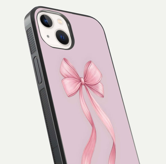 Soft Blush Bow iPhone 14 glass phone case angled back view highlighting bow artwork and side grip texture