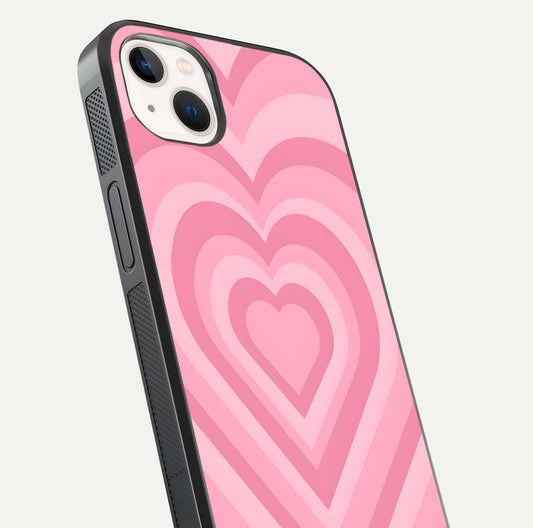 Blush Heart Waves iPhone 14 Plus glass phone case angled back view highlighting romantic heart wave artwork and grip texture