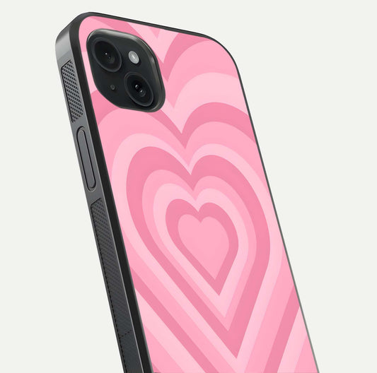 Blush Heart Waves iPhone 15 Plus glass phone case angled back view highlighting romantic heart wave artwork and grip texture