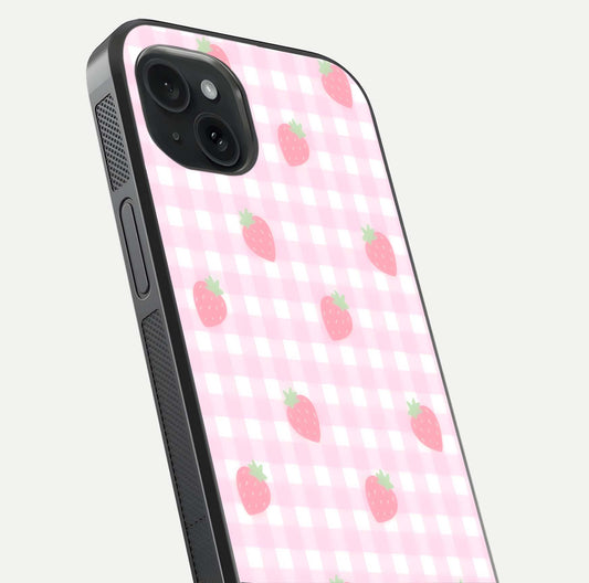 Strawberry Picnic Love iPhone 15 Plus glass phone case angled back view highlighting strawberry illustrations and textured grip