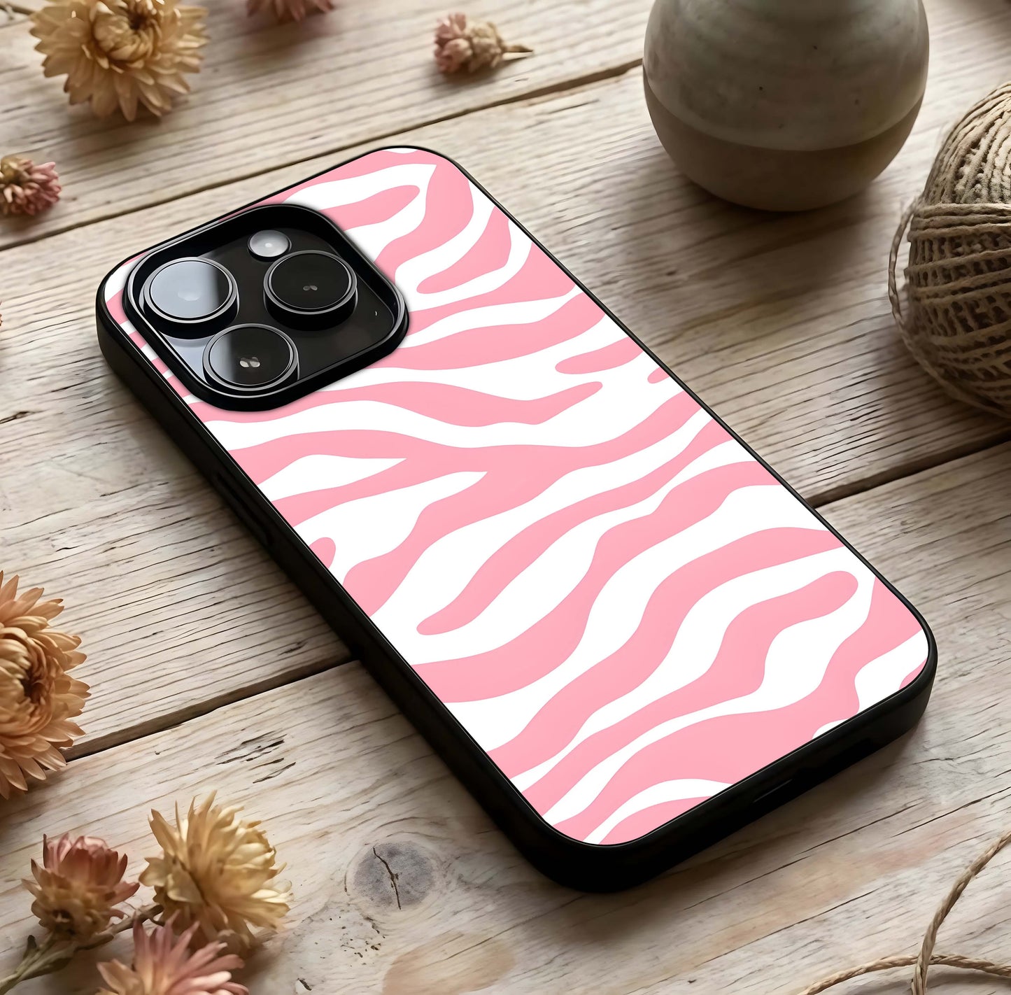 Blush Zebra Flow Glass Case photographed in natural light showing reflective finish and graphic depth.