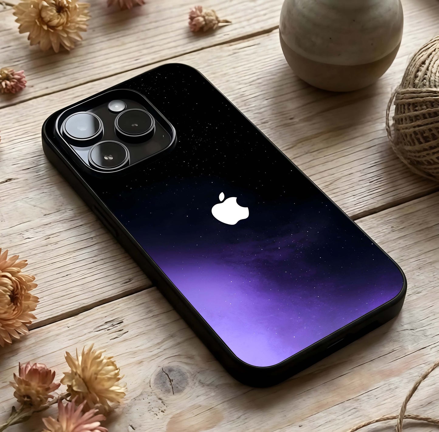 Galaxy Apple Aura Glass Case photographed in natural light showing reflective finish and celestial depth.