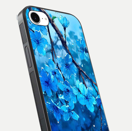 Blue Blossoms Branch Glass Case for iPhone 16e close-up angle highlighting petal details and reflection gloss