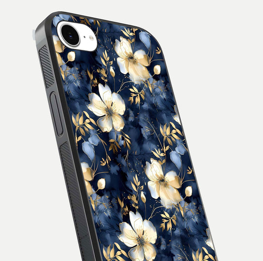 Golden Midnight Bloom Glass Case for iPhone 16e close-up angled shot showing floral detail and reflection shine