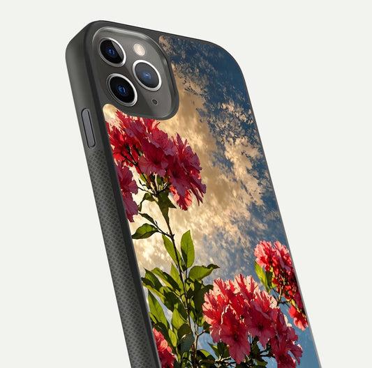Red Bloom Skies Glass Case for iPhone 11 Pro Max side-angle image showing reflection, print clarity, and tone blend