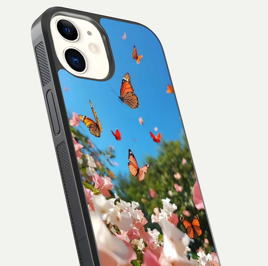 Butterflies in Bloom Sky Glass Case for iphone-12 close-up shot showing wings, petal reflections, and soft hues