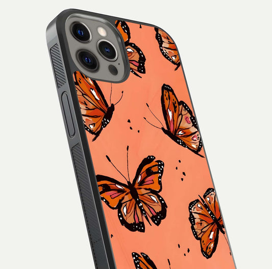 Coral Wing Butterfly Glass Case for iPhone 12 Pro Max close-up highlighting wing pattern, coral tones, and reflection shine