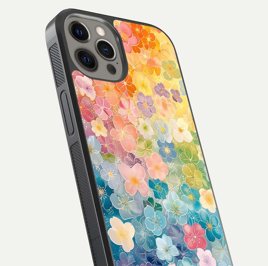 Rainbow Blossom Burst Glass Case for iPhone 12 Pro Max close-up angled shot showing petal colors and reflection