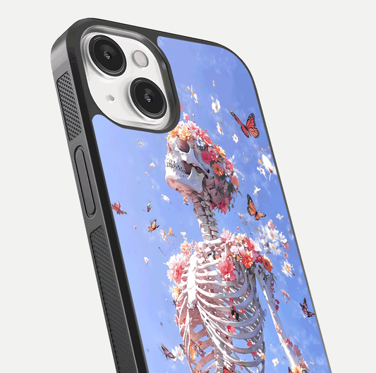 Bloom Beyond Bones Glass Case for iPhone 13 close-up highlighting unique bone-floral fusion art and reflection