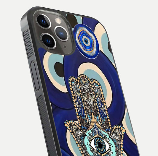 Hamsa Divine Guard Glass Case for iPhone 13 Pro close-up angled shot showing detailed palm motif and reflection glow
