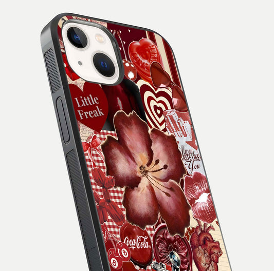 Aesthetic Little Freak Glass Case for iPhone 14 close-up angled shot showing detailed artwork, bold design, and gloss reflection