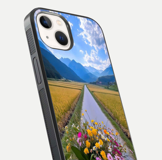 Golden Field Journey Glass Case for iPhone 14 close-up angled shot showing sunlight tones and reflection clarity