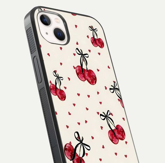 Cherry Heart Bow Glass Case for iPhone 14 Plus close-up highlighting small bows, cherry red tones, and gloss shine
