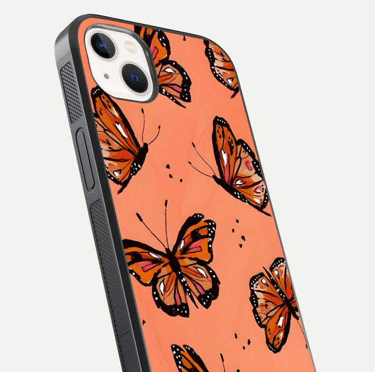 Coral Wing Butterfly Glass Case for iPhone 14 Plus close-up highlighting wing pattern, coral tones, and reflection shine
