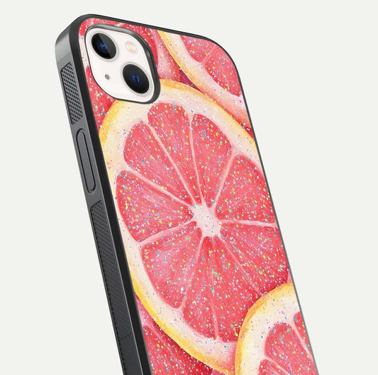 Glitter Grapefruit Glass Case for iPhone 14 Plus close-up angled shot showing fruit texture and glitter reflection