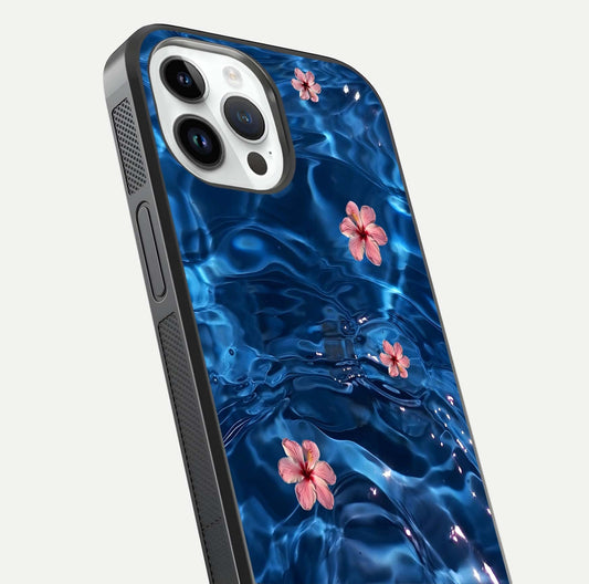 Blooming Water Drift Glass Case for iPhone 14 Pro close-up angle showing petal details, soft aqua tones, and smooth gloss reflection