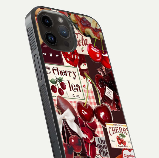 Aesthetic Cherry Tea Glass Case for iPhone 14 Pro Max close-up angled shot showing detailed cherry artwork, red tones, and gloss reflection
