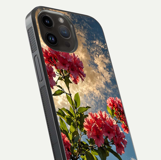 Red Bloom Skies Glass Case for iPhone 14 Pro Max close-up angled shot highlighting detailed blooms and reflection