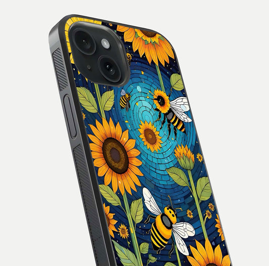 Bees & Sunflowers Glass Case for iPhone 15 close-up angled shot showing detailed petals, bee prints, and glass reflection