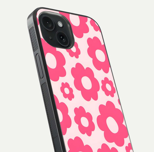Blush Flower Pop iPhone 15 glass phone case angled back view highlighting bright floral pop design and side grip texture