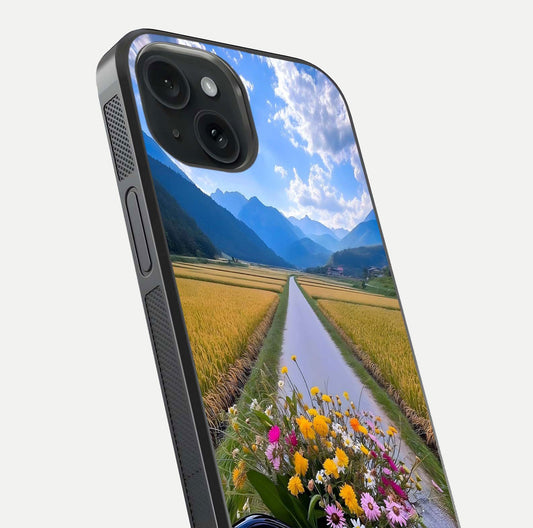 Golden Field Journey Glass Case for iPhone 15 close-up angled shot showing sunlight tones and reflection clarity