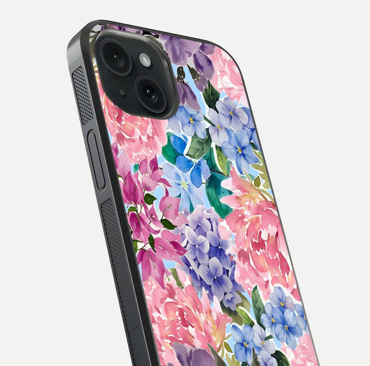 Pastel Floral Mix Glass Case for iPhone 15 close-up angled shot highlighting flower detail and reflection