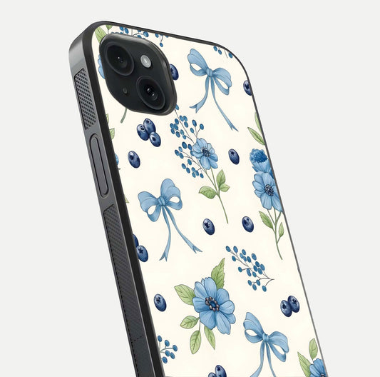 Blue Flower & Bow Glass Case for iPhone 15 Plus close-up shot highlighting ribbon detail and flower gloss finish