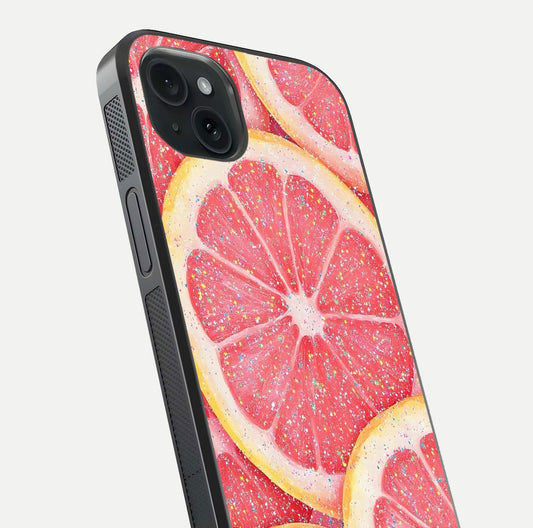 Glitter Grapefruit Glass Case for iPhone 15 Plus close-up angled shot showing fruit texture and glitter reflection