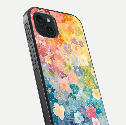 Rainbow Blossom Burst Glass Case for iPhone 15 Plus close-up angled shot showing petal colors and reflection