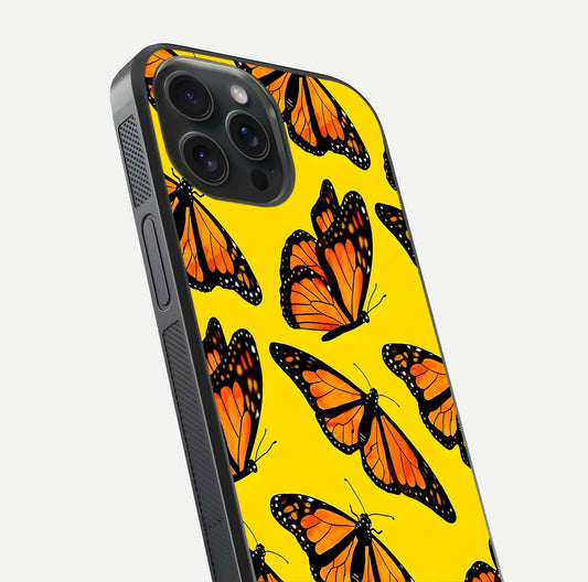 Golden Wing Flight Glass Case for iPhone 15 Pro close-up angled shot showing metallic wing texture and shine detail
