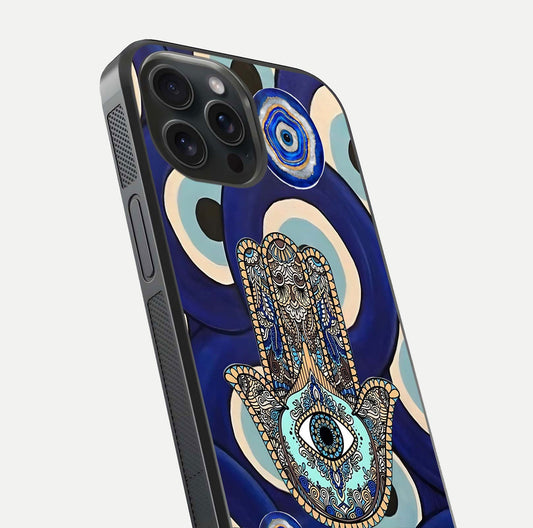 Hamsa Divine Guard Glass Case for iPhone 15 Pro close-up angled shot showing detailed palm motif and reflection glow