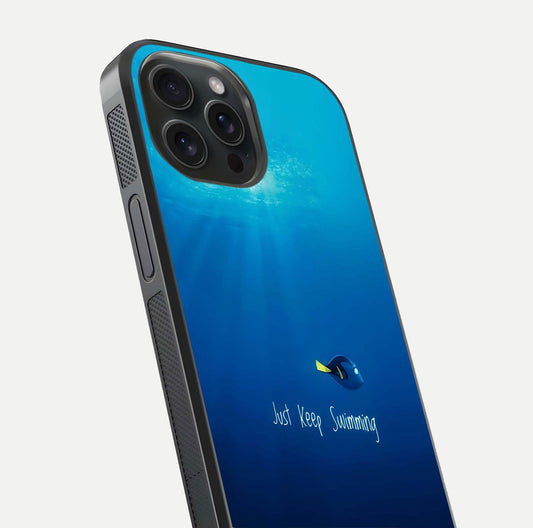 Just Keep Swimming Glass Case for iPhone 15 Pro close-up angled shot showing elegant lettering and blue tone reflection