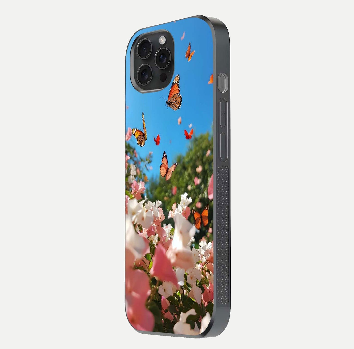 Butterflies in Bloom Sky Glass Case for iPhone 15 Pro side-angle image showing delicate details and gloss polish