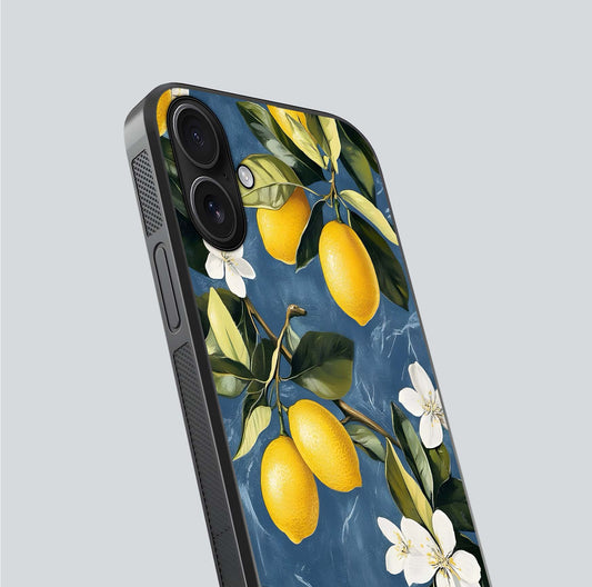 Lemon Dream Garden Glass Case for iPhone 16 close-up angled shot showing fruit details and shine reflection