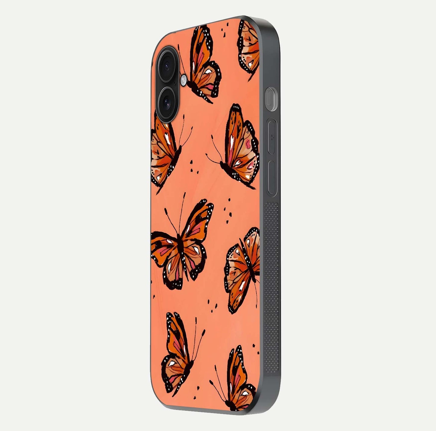 Coral Wing Butterfly Glass Case for iPhone 16 Plus side-angle photo showing reflective finish and smooth edges
