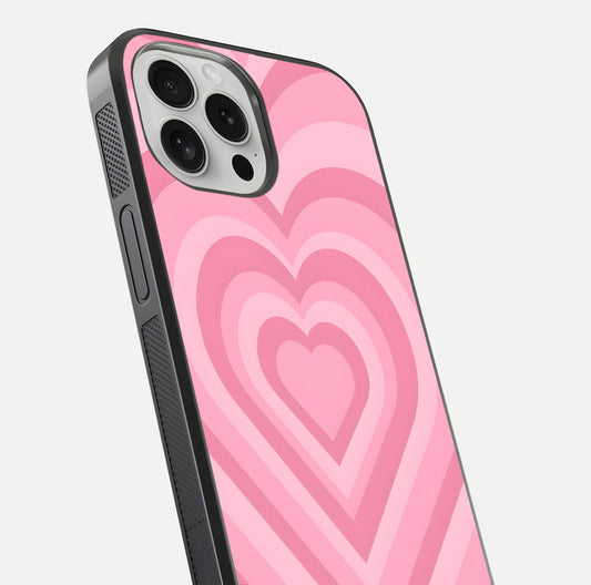 Blush Heart Waves iPhone 16 Pro glass phone case angled back view highlighting romantic heart wave artwork and grip texture