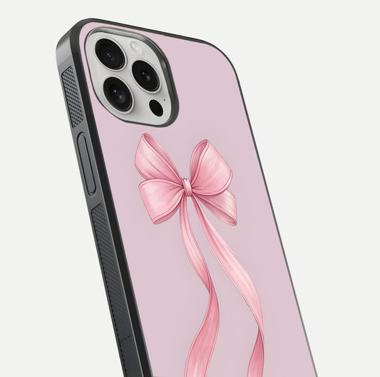 Soft Blush Bow iPhone 16 Pro glass phone case angled back view highlighting bow artwork and side grip texture