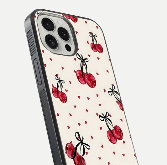 Cherry Heart Bow Glass Case for iPhone 16 Pro close-up highlighting small bows, cherry red tones, and gloss shine