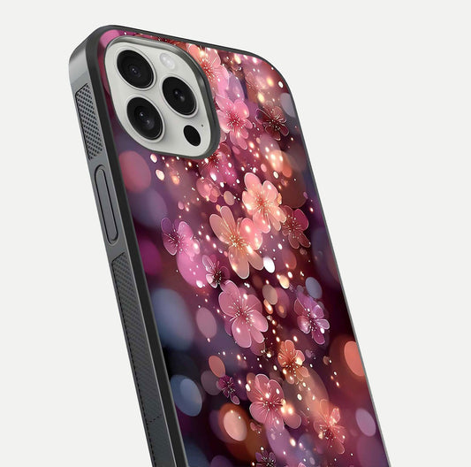 Glowing Petal Bliss Glass Case for iPhone 16 Pro close-up angled shot showing petal glow, color depth, and reflection shine