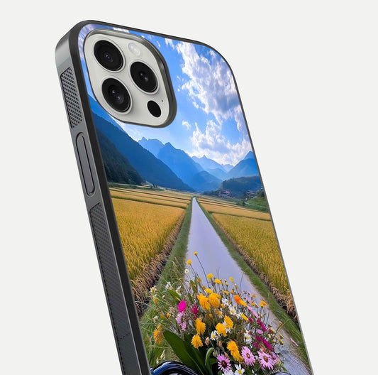 Golden Field Journey Glass Case for iPhone 16 Pro close-up angled shot showing sunlight tones and reflection clarity