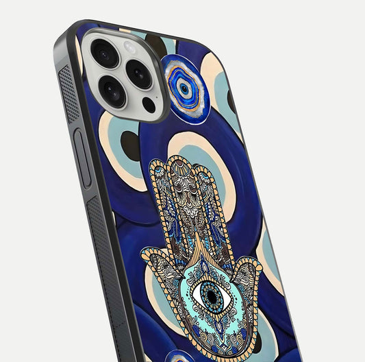 Hamsa Divine Guard Glass Case for iPhone 16 Pro close-up angled shot showing detailed palm motif and reflection glow