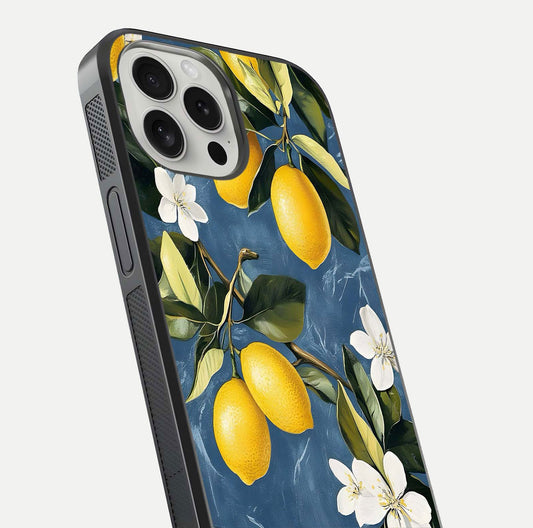 Lemon Dream Garden Glass Case for iPhone 16 Pro close-up angled shot showing fruit details and shine reflection