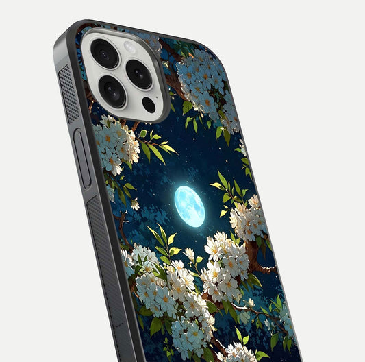Moonlit Blossom Dream Glass Case for iPhone 16 Pro close-up angled shot showing glowing petals and reflection