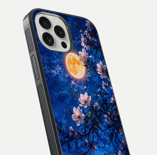 Moonlit Blossoms Night Glass Case for iPhone 16 Pro close-up angled shot showing petal glow and reflection detail