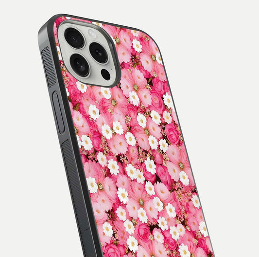 Pink Daisy Bliss Glass Case for iPhone 16 Pro close-up angled shot highlighting daisy detail and reflection glow