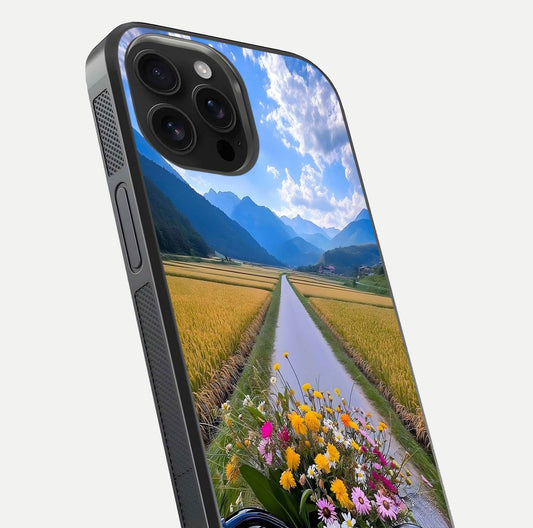 Golden Field Journey Glass Case for iPhone 16 Pro Max close-up angled shot showing sunlight tones and reflection clarity