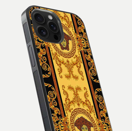 Golden Royal Heritage Glass Case for iPhone 16 Pro Max close-up angled shot showing intricate design and metallic reflection